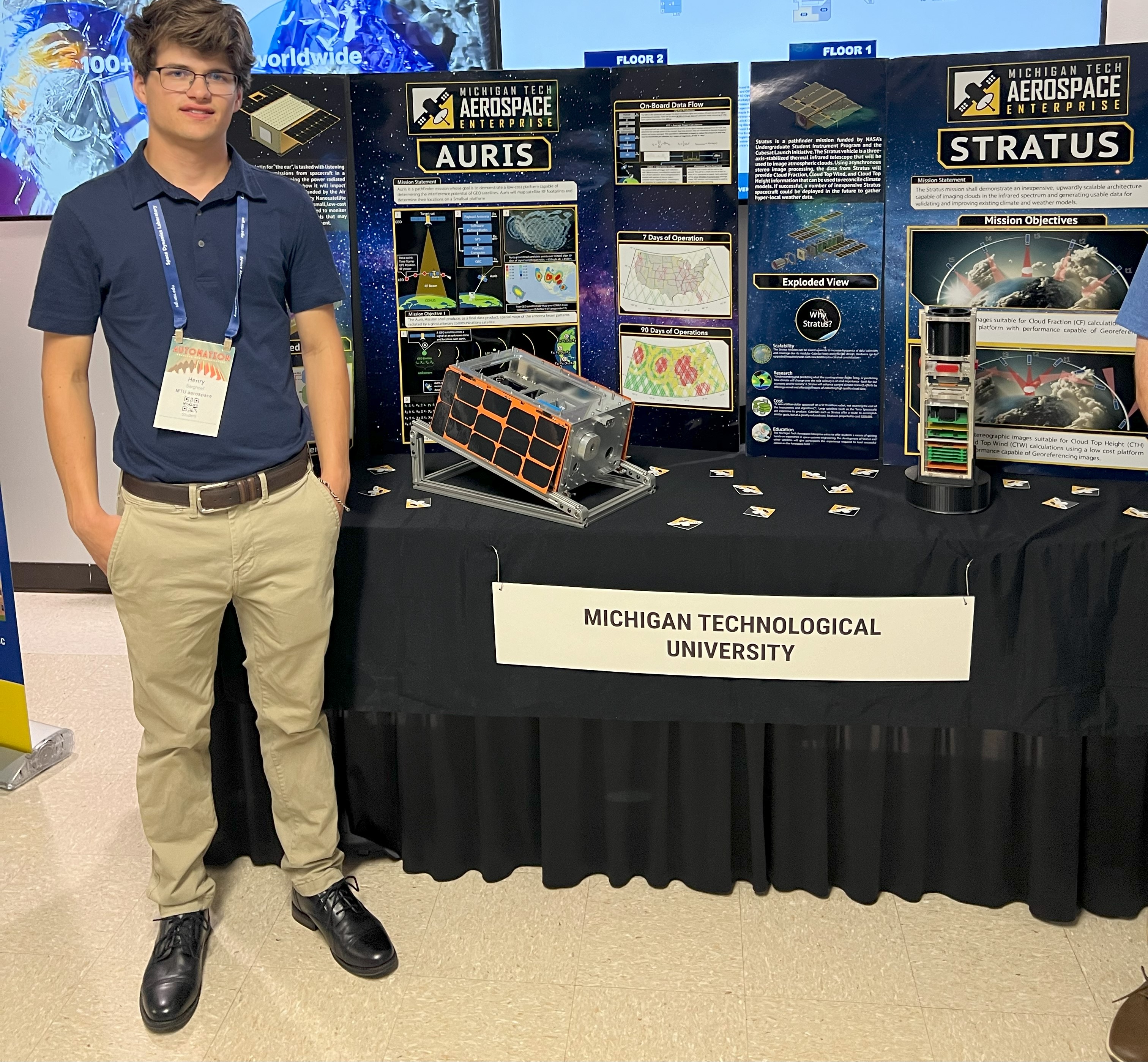 Henry at the MTU smallsat stand